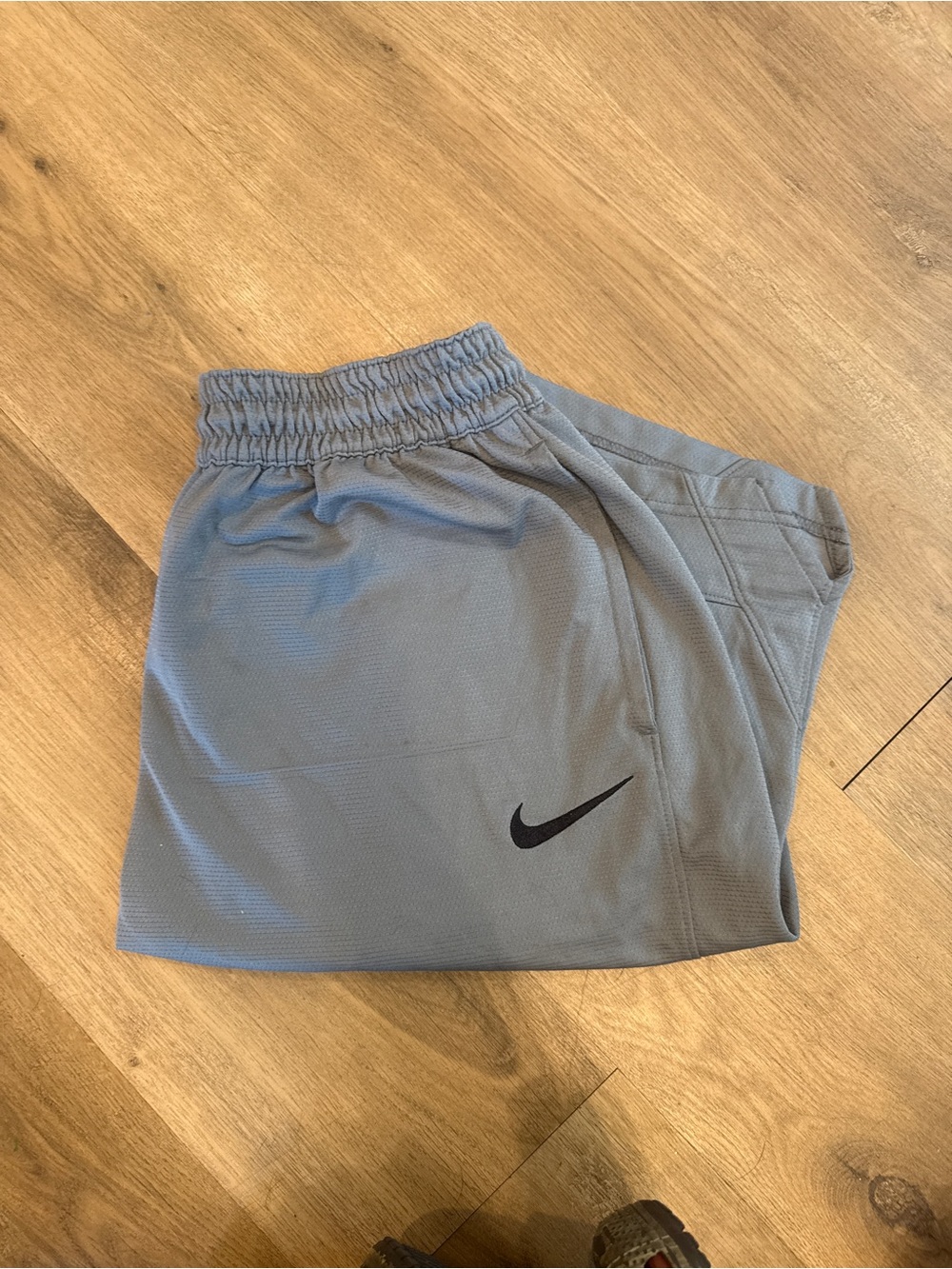 Nike Gray Athletic Shorts with Black Swoosh